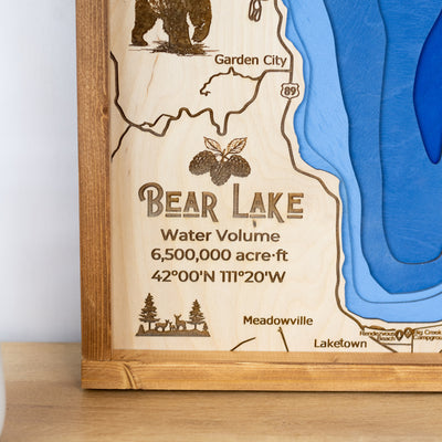 bottom left corner of Bear Lake wooden map displaying details about the size & depth of the lake