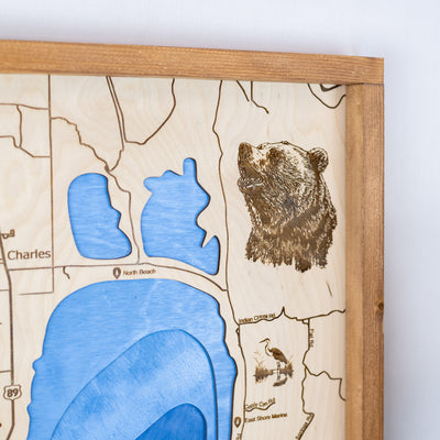 up close details of top right corner of Bear Lake wooden map displaying engraving details