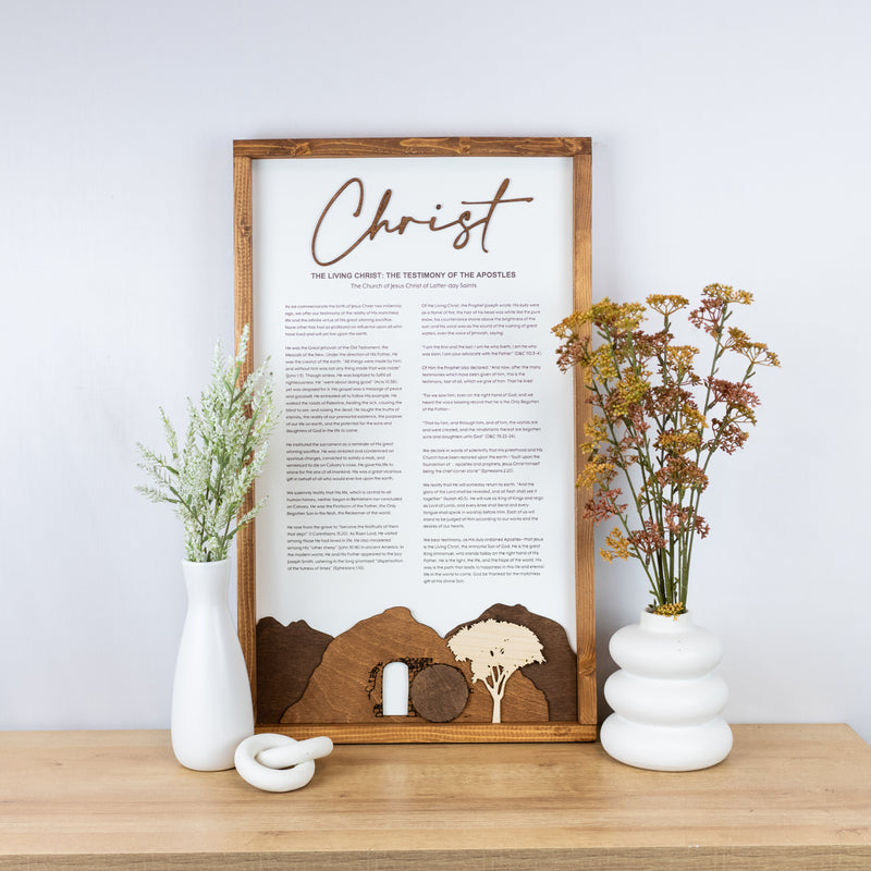 The Living Christ wooden sign with resurrection tomb scene