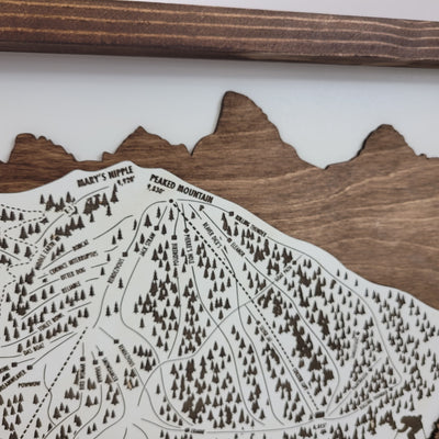 close up of Wooden ski map of Grand Targhee with engraved trails and mountain peaks 